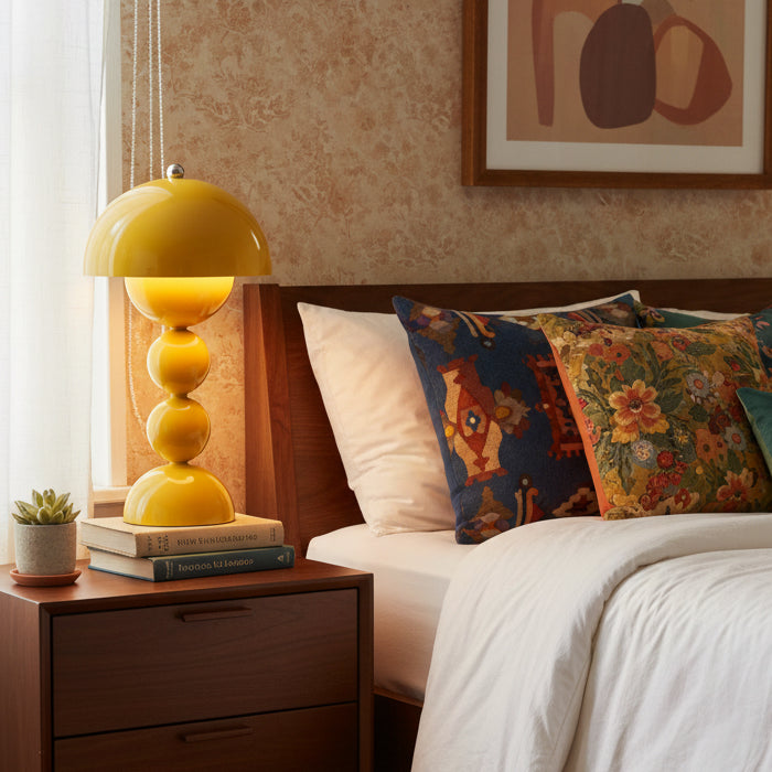 Yellow table lamp with a unique design on a white background